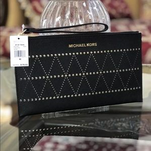 NWT Michael Kors perforated leather clutch